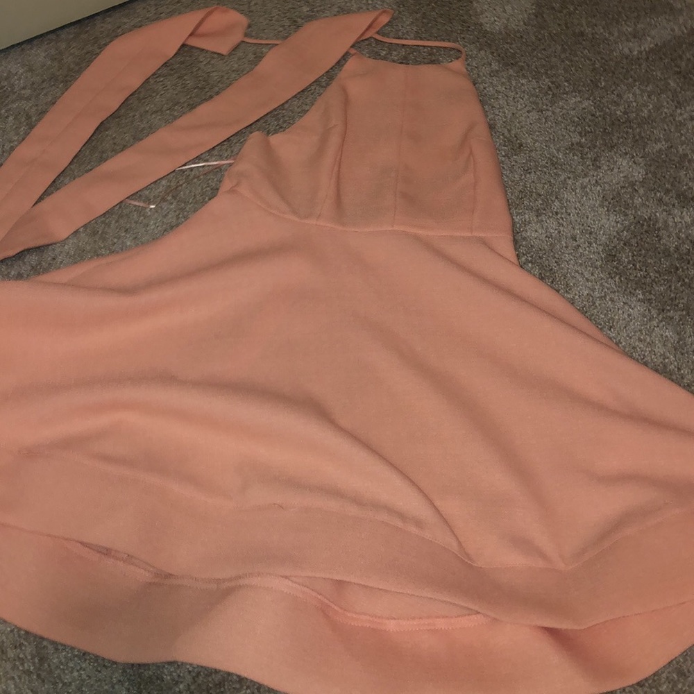 Very cute backless pink dress.